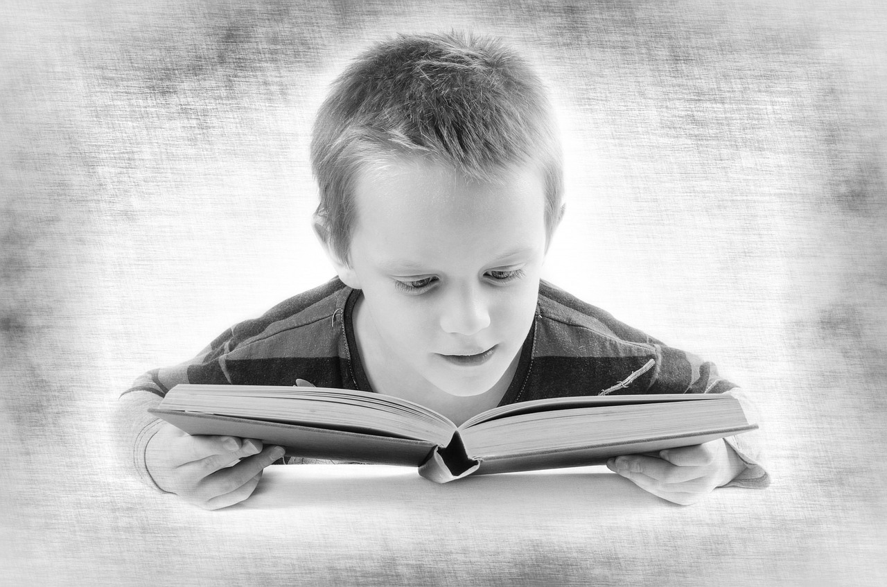 Partially sighted child reading